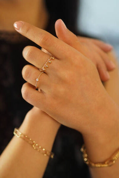 Gold rings accumulation on a woman hand