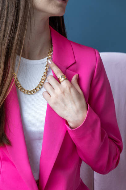 Woman's hands close up wearing rings and necklace modern accessories elegant lifestyle